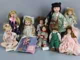 a lot of dolls that are sitting together on the floor