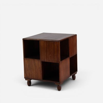an image of a small wooden table with four cubes on wheels