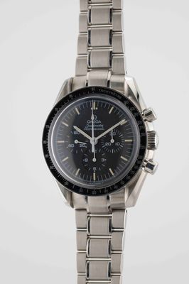 a close up of a watch on a white surface with a white background