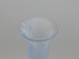 a glass vase that is sitting on a table