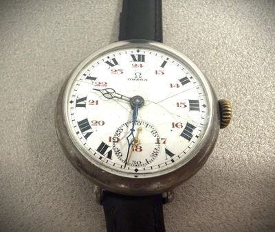 a close up of a watch with roman numerals on it