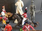 a lot of figurines that are on a table