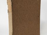 a brown book with a brown cover sitting on top of a white surface