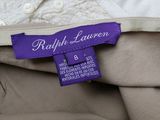 a close up of a purple label on a white shirt