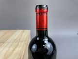 a bottle of wine that is sitting on a table