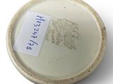a small white bowl with a label on it