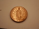 a coin with a picture of a woman on it