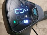 a digital clock on the handlebar of a bike