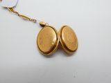 an image of a gold locke with a chain attached to it