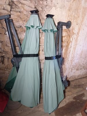 two umbrellas that are hanging on the wall