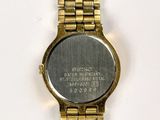 an image of a close up of a wrist watch on a white surface