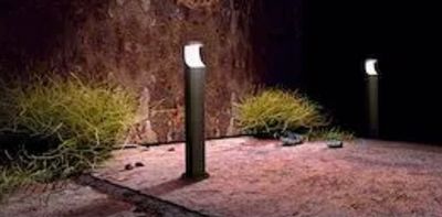 two lights that are lit up in the dark