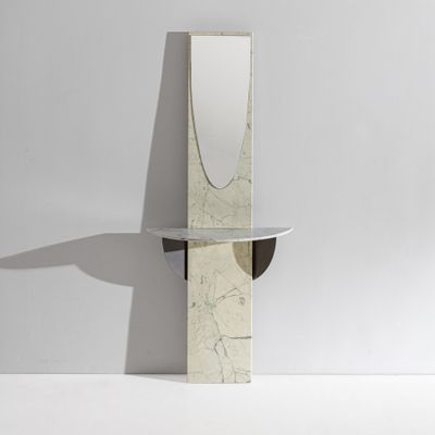mirror and shelf in the shape of a mirror on a white wall