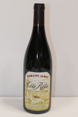 a bottle of wine that is sitting on a table
