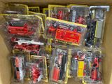a lot of toy fire trucks in a box