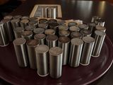 a plate with a lot of cups and saucers on it