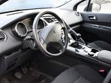a car dashboard with a steering wheel and a dash board