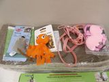 a bag of stuffed animals and other items on a table