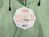 a green rain jacket with a tag on it