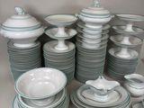 a lot of plates and bowls sitting on a table