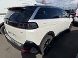 the rear end of a white suv parked in a parking lot