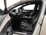 the interior of a car with the door open and the driver ' s seat down