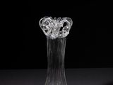 a glass vase that is sitting on a table