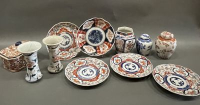 many plates and cups that are sitting on a table