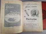 an open book with a picture of a man on a boat in the water