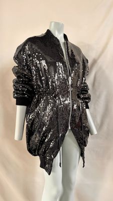 an image of a mannequin wearing a black jacket with sequins on it