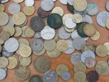 a lot of coins that are on the table