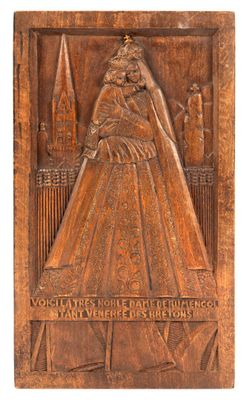 a wooden plaque with a woman in a dress on it