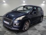 the small blue car is parked in a large room