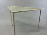 an image of a white table with a triangular top on a white background