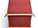 an image of a red chair with a wooden frame on a white background