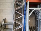 a rack with a lot of metal items on it in a warehouse