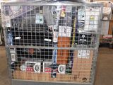 a metal cart with many items in it in a warehouse