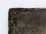 a piece of metal with a rusted surface on it