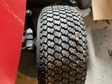 a close up of a tire on a lawn mower