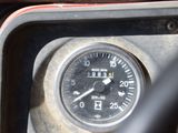 a close up of a gauge on the dashboard of a vehicle