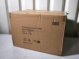 a box that is sitting on the floor in front of a wall