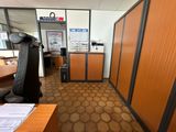 an image of an office with a desk and a chair