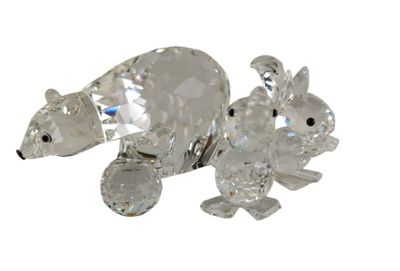 a crystal figurine of a polar bear and a bear cub