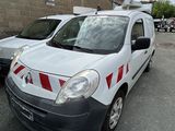 a white van with red and white stripes parked in a parking lot
