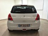 a white car that is parked in a garage
