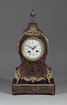 a small clock that is sitting on a table