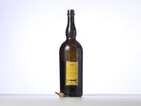 a bottle of wine sitting on a table next to a cigarette