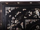 a picture of a black and gold oriental style cabinet