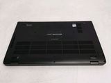 a laptop that is sitting on a white surface