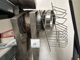 a picture of a kitchen with a lot of pots and pans hanging from the wall
